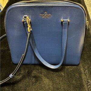 Kate Spade royal blue handbag with strap.